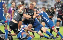  ?? Picture: Gallo Images ?? Jean-Luc du Preez is boxed in during the Super Rugby encounter against the Sharks at Kings Park yesterday.