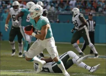  ?? LYNNE SLADKY — ASSOCIATED PRESS ?? Miami Dolphins outside linebacker Kiko Alonso (47) intercepts a pass intended for New York Jets wide receiver Deontay Burnett (18), during the first half of an NFL football game, Sunday, Nov. 4, 2018, in Miami Gardens, Fla.