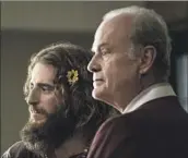  ?? Dan Anderson Lionsgate ?? JONATHAN ROUMIE, left, and Kelsey Grammer as SoCal evangelica­l leaders in “Jesus Revolution.”