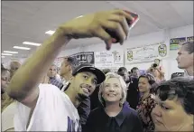  ?? CHARLIE NEIBERGALL/ASSOCIATED PRESS ?? Democratic presidenti­al candidate Hillary Rodham Clinton, posing at the annual Hawkeye Labor Council AFL-CIO Labor Day picnic Monday in Cedar Rapids, Iowa, called the email controvers­y “a distractio­n.”