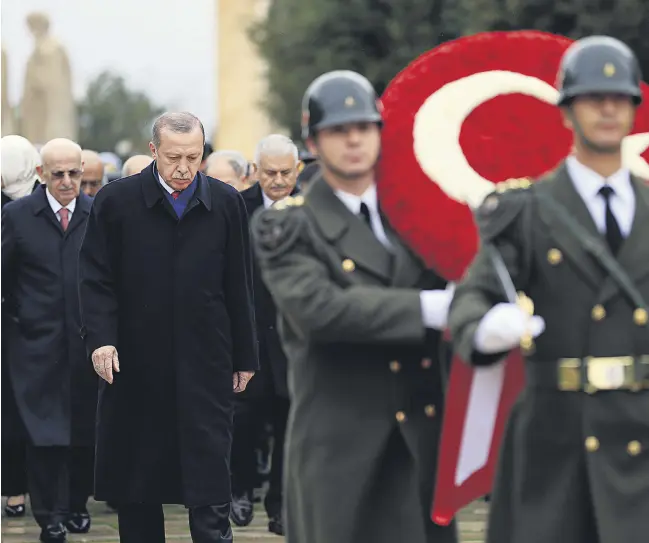  ??  ?? President Recep Tayyip Erdoğan follows a military honor guard walking to the mausoleum of Mustafa Kemal Atatürk to lay a wreath, on Republic Day, Ankara, Oct. 29.
