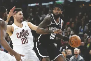  ?? CHRISTOPHE ENA/AP ?? BROOKLYN NETS’ ROYCE O’NEALE (RIGHT) drives around Cleveland Cavaliers’ Georges Niang during the game between Brooklyn Nets and Cleveland Cavaliers at the Accor Arena in Paris on Jan. 11.