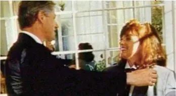  ??  ?? Claims: Bill Clinton and volunteer Kathleen Willey at a White House function