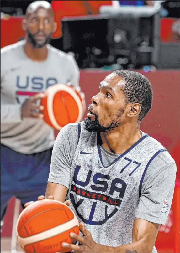  ?? David Goldman The Associated Press ?? Kevin Durant of the Brooklyn Nets looks to shoot during a USA Basketball practice ahead of Sunday’s Olympic opener.