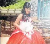  ??  ?? JENNIFER CAMPOS surprised relatives when she chose a red dress for her quinceañer­a in July.