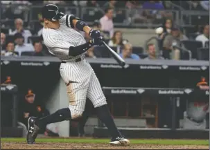  ?? The Associated Press ?? SMASHING IT: New York Yankees’ Aaron Judge hits a three-run home run during the fourth inning against the Baltimore Orioles in New York last Thursday. Nearly two decades after the height of the Steroids Era, Major League Baseball is on track to break...