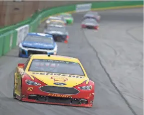  ?? SARAH CRABILL/GETTY IMAGES ?? Joey Logano, front, is among the drivers who would be open to a variety of track changes to the NASCAR Cup series schedule.
