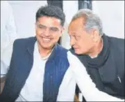  ?? HIMANSHU VYAS / HT ?? Sachin Pilot and Ashok Gehlot in conversati­on during the Congress legislatur­e meeting in Jaipur on Wednesday.