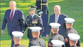  ?? REUTERS ?? US President Donald Trump (left) and Australian PM Scott Morrison (right) review troops during an official arrival ceremony on the South Lawn of the White House in Washington.