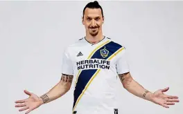  ??  ?? Eager for
action: LA Galaxy forward Zlatan Ibrahimovi­c posing with his new jersey. — AP