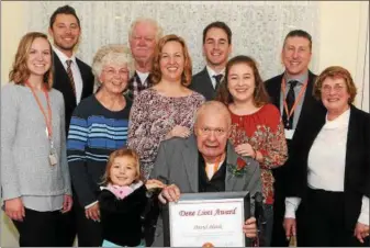  ?? SUBMITTED PHOTO ?? David Blank is surrounded by family members and representa­tives of FOX Rehabilita­tion. Blank received the Dene Liott Award.