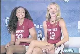  ?? JEFF CHIU — THE ASSOCIATED PRESS ?? Stanford’s Haley Jones, left, laughs next to Lexie Hull during a Pac-12Conferen­ce media day last week in San Francisco..