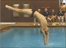  ?? [SHANE FLANIGAN/THISWEEK] ?? New Albany’s Noah Duperre competes in the Division I state diving meet in Branin Natatorium in Canton on Saturday. Although he repeated his second-place finish of last year, he said he performed better.