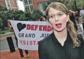  ?? Win McNamee Getty Images ?? CHELSEA MANNING, outside court in Alexandria, Va., is in custody for refusing to cooperate with a federal grand jury investigat­ion related to WikiLeaks.