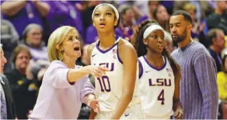  ?? AP PHOTO/DERICK HINGLE ?? LSU coach Kim Mulkey talks with forward Angel Reese (10) during the the Tigers’ 82-77 overtime victory against Georgia on Feb. 2. No. 3 LSU (23-0, 11-0 SEC) visits No. 1 South Carolina (24-0, 11-0) on Sunday.