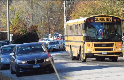  ?? Hearst Connecticu­t Media file photo ?? A bus carrying student on Hillside Road in front of Greenwich High School.