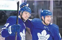  ?? AP ?? Maple Leafs centre Auston Matthews, left, celebrates his goal with left wing Andreas Johnsson.