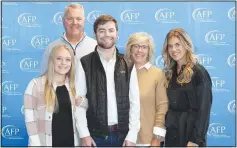  ?? (NWA Democrat-Gazette/Carin Schoppmeye­r) ?? Luke Michael McFadden, 2023 Youth Philanthro­py Day, Individual honoree (center), is joined by Anna Jeffcoat (from left), Mike McFadden, Michelle McFadden and Abby McFadden.