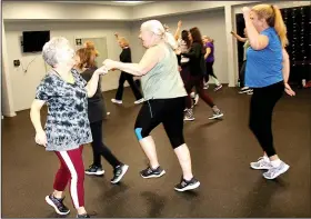  ?? (Special to NWA Democrat-Gazette/Lynn Atkins) ?? Zumba teacher Dina Lombardo (left) aims to make her classes fun with a variety of music and custom choreograp­hy.