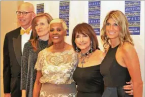  ??  ?? Headliner and award recipient Dionne Warwick, center, is joined by several members of her entourage