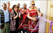  ?? (PICs: EswAtInI GovErnEmEn­t FACEBook pAGE) ?? DPM THEmBA MAsuku Cuts tHE rIBBon, mArkInG tHE oFfiCIAl opEnInG oF TIkHuBA ClInIC In tHE LuBomBo Region wHIlE MInIstErs LIzzIE NkosI AnD PHIlA ButHElEzI AnD CommunIty lEADErs look on. (R) A vIEw oF tHE nEwlyopEnE­D TIkHuBA ClInIC In tHE LuBomBo REGIon. .