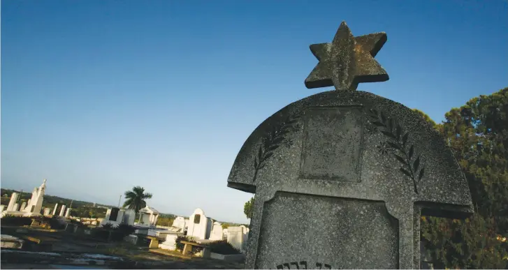  ?? ( Claudia Daut/ Reuters) ?? A HEADSTONE with a Star of David stands at the Jewish cemetery in Guanabacoa near Havana, Cuba, in 2007.