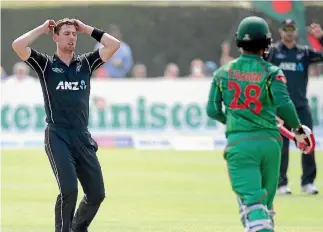  ?? PHOTO: INPHO ?? New Zealand’s Matt Henry, left, can’t watch as Tamim Iqbal moves Bangladesh closer to their winning target.
