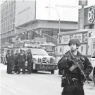  ??  ?? Heavily armed police respond to the explosion Monday morning under the Port Authority Bus Terminal. Authoritie­s see it as an isolated attack. SETH HARRISON/USA TODAY NETWORK