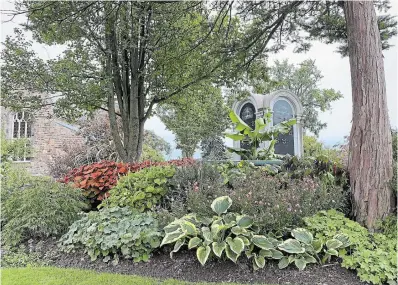  ??  ?? PHOTOGRAPH­Y BY KATHY RENWALD Dating back to 1850 and designed as a garden cemetery, the Hamilton Cemetery has mature tree specimens and layered gardens with unusual plants.
Chris Schofield put in a new pollinator garden at the cemetery this year.