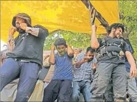  ?? WASEEM ANDRABI/HT ?? Lashkareta­iba militant Naveed Jatt (right) fires during the funeral procession of two militants in ■Jammu and Kashmir’s Shopian on Saturday.