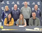  ?? Scott Herpst ?? Gordon Lee senior softball player Emma Minghini was joined by parents Cherie and Jason Minghini as she signed her letter of intent to play softball at Georgia Tech. Also on hand for the ceremony were Gordon Lee head coach Dana Mull, Gordon Lee assistant coach Thomas Gray, Gordon Lee principal Michael Langston and Gordon Lee athletic director Todd Windham.