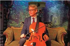  ??  ?? David Teie, a US composer and cellist, looks on during an interview to promote his new album ‘Music for Cats’ at Lady Dinah’s Cat Emporium in London. — AFP photos