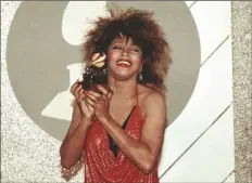  ?? AP PHOTO/NICK UT ?? Tina Turner, Pop and R&B vocalist, as holds up a Grammy Award, Feb. 27, 1985, in Los Angeles.