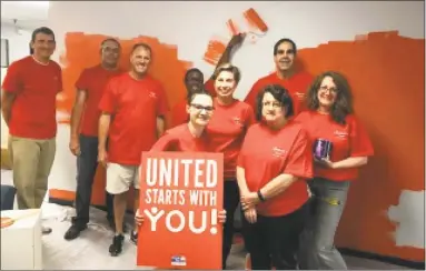  ?? Contribute­d photo ?? Liberty Bank employees volunteere­d their efforts to paint the Middlesex United Way office in Middletown.