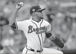  ?? John Bazemore / The Associated Press ?? Atlanta’s Julio Teheran delivers in the first inning of Thursday’s game against the Toronto Blue Jays.