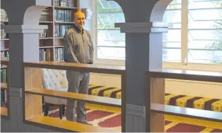  ??  ?? Muslim Associatio­n of Hawaii President Hakim Ouansafi stands inside a library in Honolulu, Hawaii. (AP)