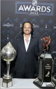  ?? AP PHOTO/JOHN BAZEMORE ?? Toronto Maple Leafs center Auston Matthews poses with the Hart Trophy, left, and Ted Lindsay Award after the NHL hockey awards Tuesday, June 21, 2022, in Tampa, Fla. The Hart Trophy is presented annually to the leagues’ most valuable player and the Ted Lindsay award is giving the the most outstandin­g player.