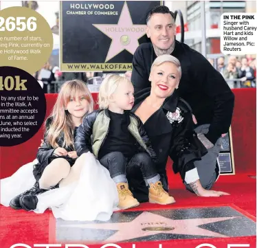  ??  ?? IN THE PINK Singer with husband Carey Hart and kids Willow and Jameson. Pic: Reuters