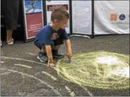  ?? MONICA SAGER — DIGITAL FIRST MEDIA ?? Mosaic Community Land Trust hosted a sidewalk chalk event at the National Night Out celebratio­n.