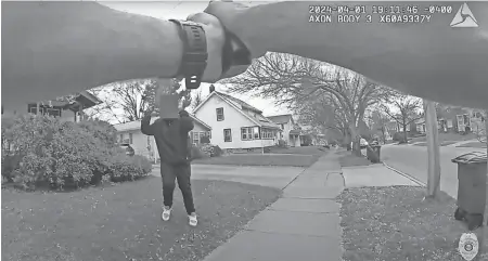  ?? AKRON POLICE BODY CAMERA FOOTAGE ?? Akron police officer Ryan Westlake confronts Tavion Koonce-williams, who was carrying a fake gun on April 1. Westlake shot Tavion in the wrist.