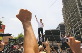  ?? Fernando Llano / Associated Press ?? Venezuelan opposition leader Juan Guaidó rallies supporters in Caracas as his bold bid to oust President Nicolas Maduro entered its second day.