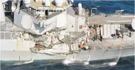  ?? IORI SAGISAWA/KYODO NEWS VIA ASSOCIATED PRESS ?? The damage of the right side of the USS Fitzgerald is seen Saturday off Shimoda, Shizuoka prefecture, Japan, after the Navy destroyer collided with a merchant ship.