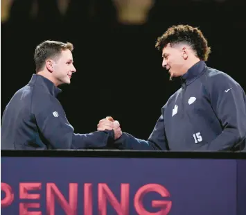  ?? MATT YORK/AP ?? 49ers quarterbac­k Brock Purdy, left, and Chiefs quarterbac­k Patrick Mahomes shake hands during Super Bowl 58 opening night on Monday.