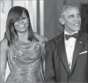  ?? AP PHOTO ?? In this Oct. 8, 2016, file photo, President Barack Obama and first lady Michelle Obama wait to greet Italian Prime Minister Matteo Renzi and his wife for a State Dinner at the White House in Washington. Sarah Hurwitz, a former speechwrit­er for the Obamas, was on the Island on Monday to present a speech entitled “Communicat­ing with Authentici­ty” to the Canadian Public Relations Society’s national conference.