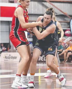  ??  ?? Mia Murray wrestles for the ball with Perth’s Darcee Garbin.
Picture: GETTY