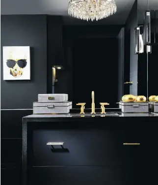  ?? PHOTOS: TOMAS PEARCE ?? Black brings a crisp, glamorous look to this Toronto condo, and for designers Mel Quilatan and Brian Woodrow, the key was to vary the scheme not just with colour but with textures and finishes.