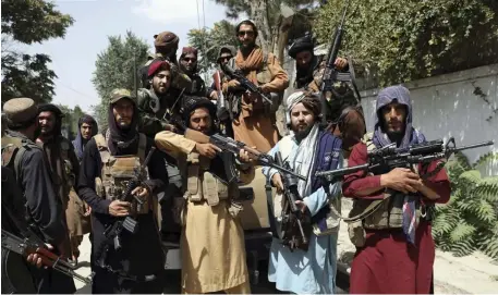  ?? AP FIle ?? ADVANCING QUICKLY: The Taliban is seeking out enemies, including those who worked with the U.S. and its allies, as they establish rule in Afghanista­n. The U.S. withdrawal date is still set for Aug. 31, per President Biden’s order.