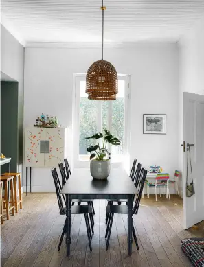  ??  ?? KITCHEN-DINER
Oversized rattan shades emphasise the room’s impressive ceiling height and are the perfect foil to the monochrome palette.
Cape table, from R40,000; Quaker chairs, R6,000 each, all Gregor Jenkin. Try the woven basket lampshades, from £64 each, Design Vintage. Oak bar stools, R2,100 each, James Mudge. House Doctor shelves in brass and Mormor green marble, £77.90 each, Connox