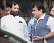  ?? PTI ?? Union ministers Nitin Gadkari (right) and Ram Vilas Paswan after a Cabinet meeting at South Block in New Delhi on Wednesday