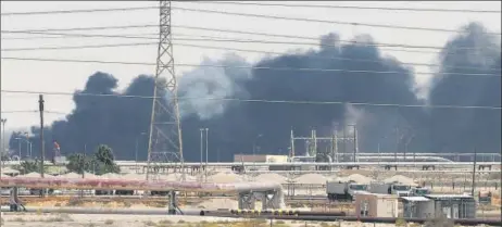  ?? REUTERS ?? Smoke is seen following a fire at Aramco facility in the eastern city of Abqaiq, Saudi Arabia on Saturday after drone attack by Iran-backed Houthi rebels.